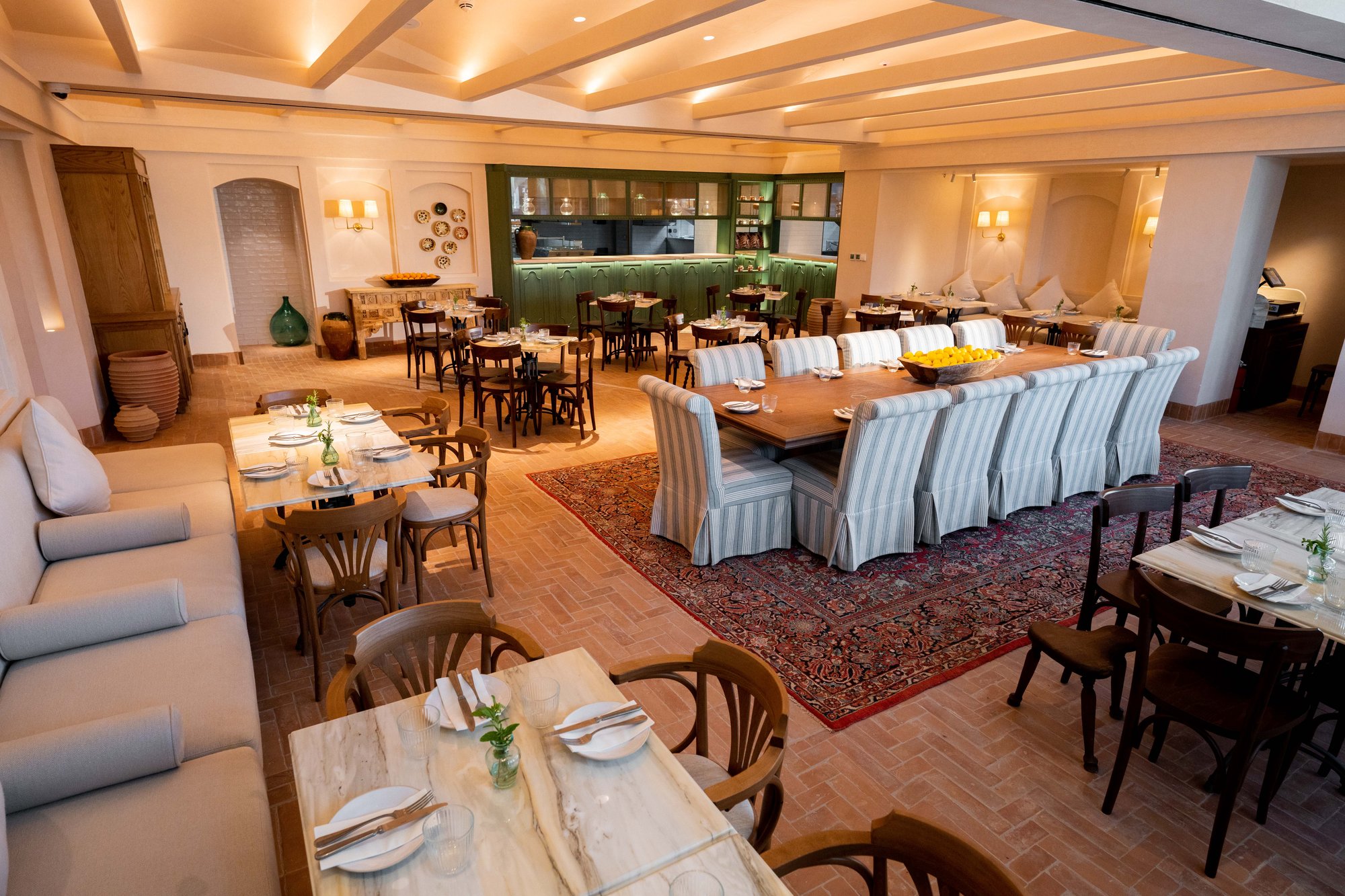 Villa Mamas Riyadh main dining room with open kitchen and long communal table