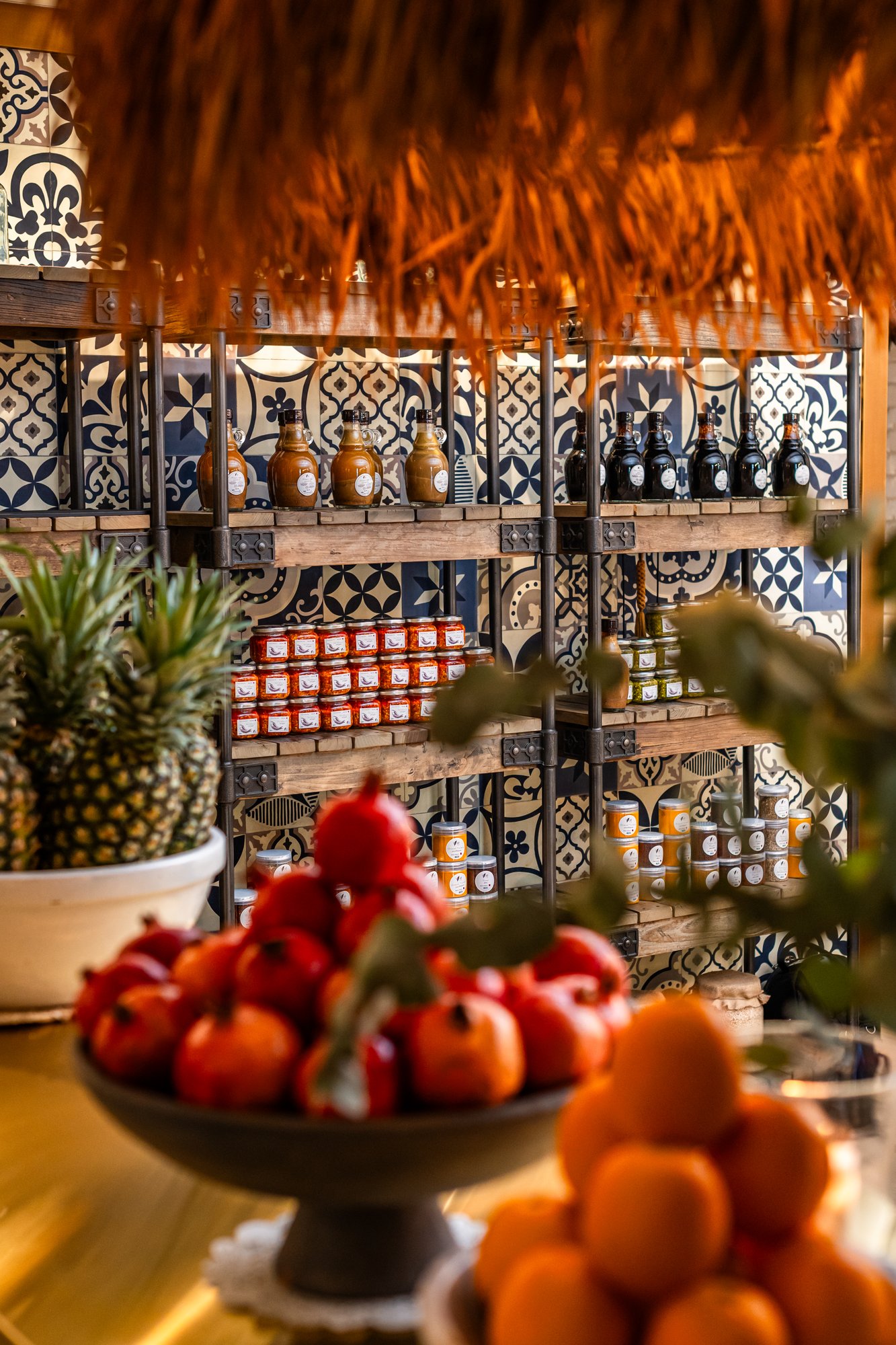 Villa Mamas Abu Dhabi retail shelves of preserves and spices against patterned tiles